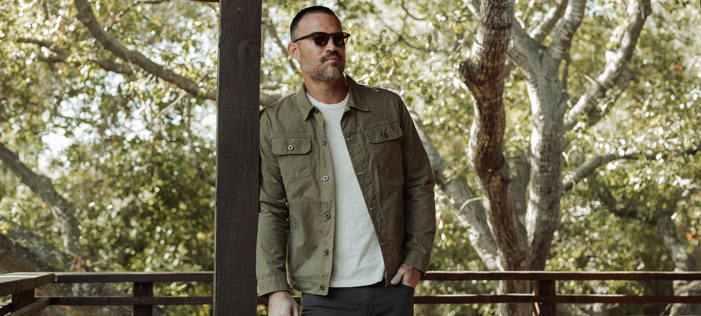 An aerial view of a field. A road runs through the upper right corner.