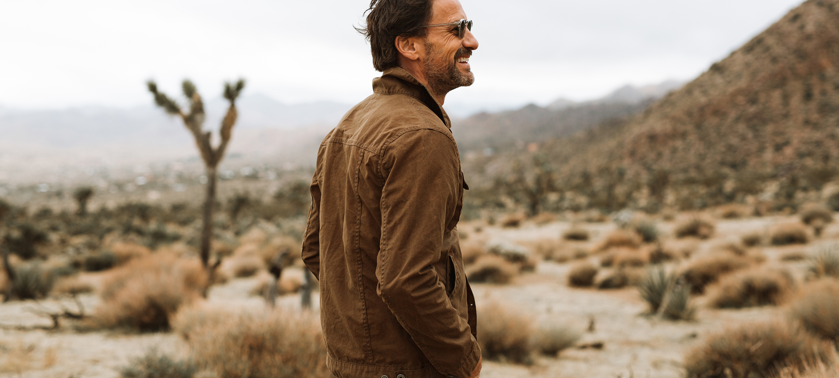 An aerial view of waves crashing against a shore.