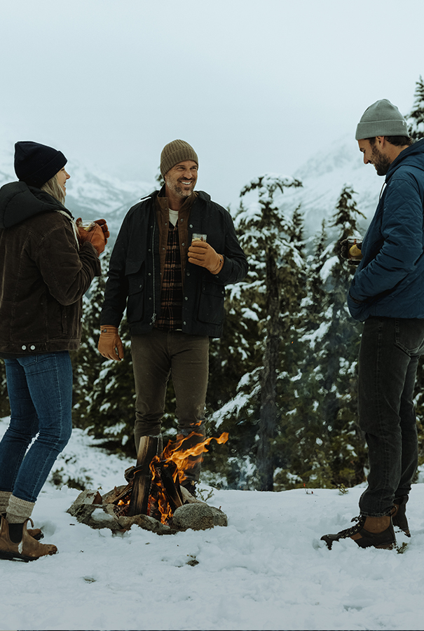 An aerial view of waves crashing against a shore.