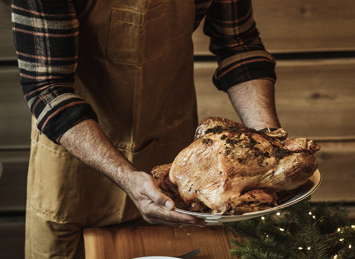 An aerial view of waves crashing against a shore.