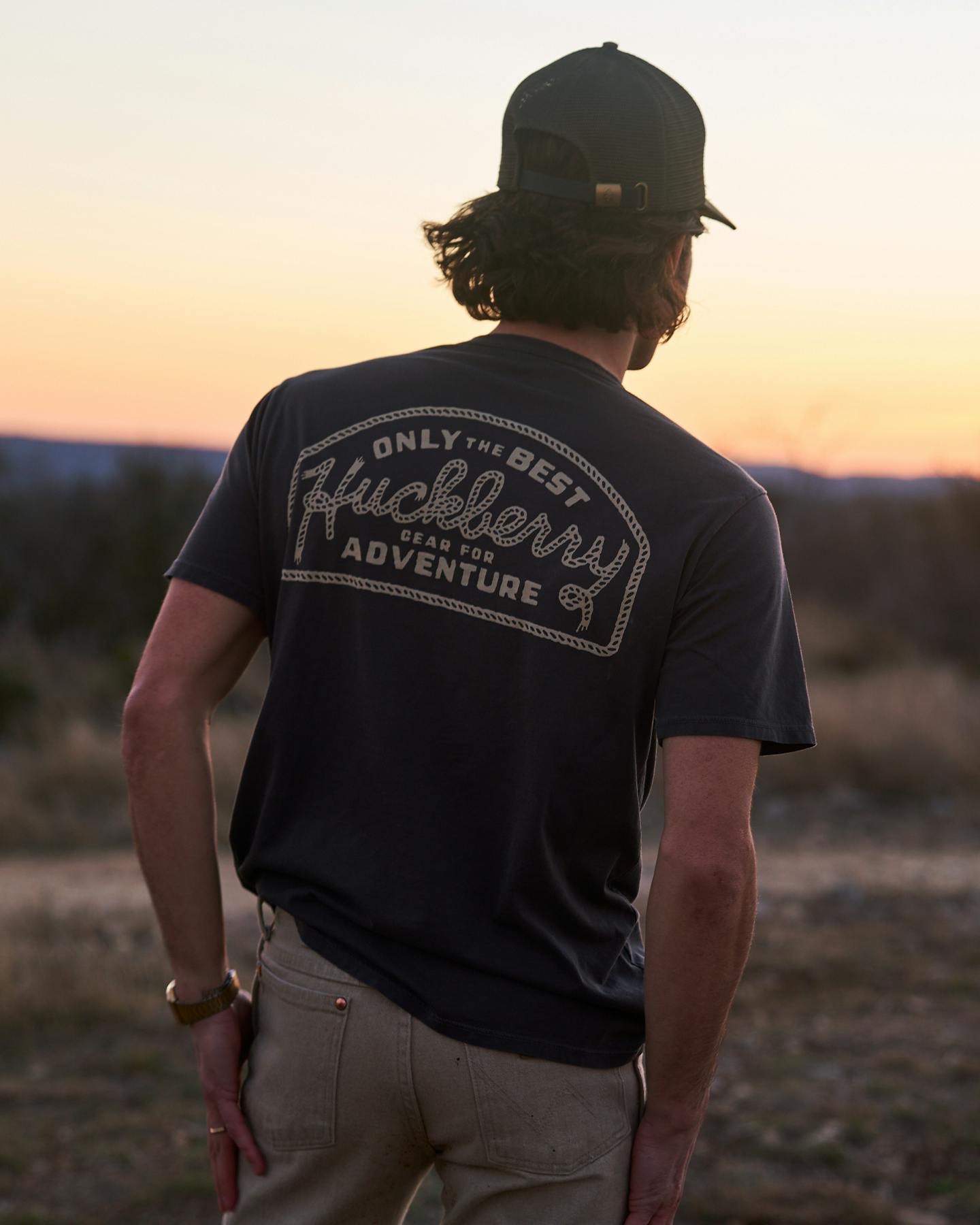 Man wearing Huckberry tshirt looking at sunset