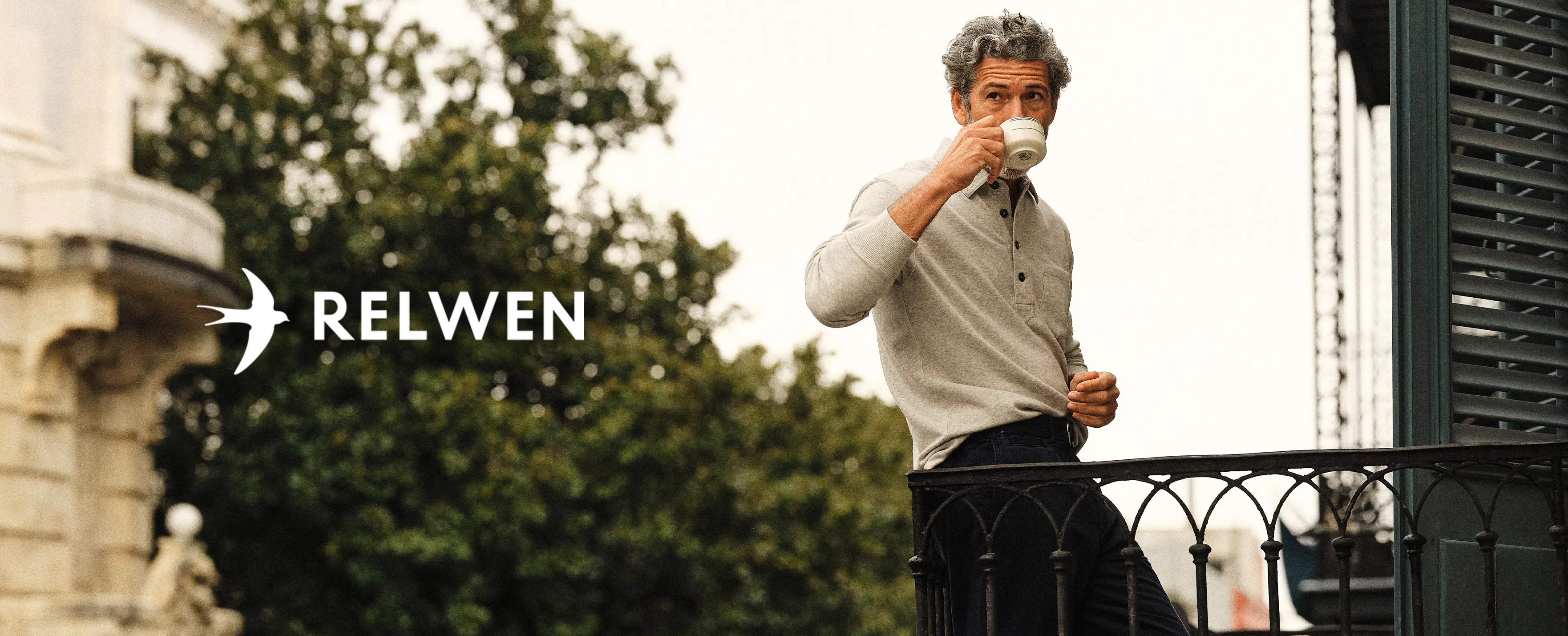 Man sitting infront of a window wearing Relwen