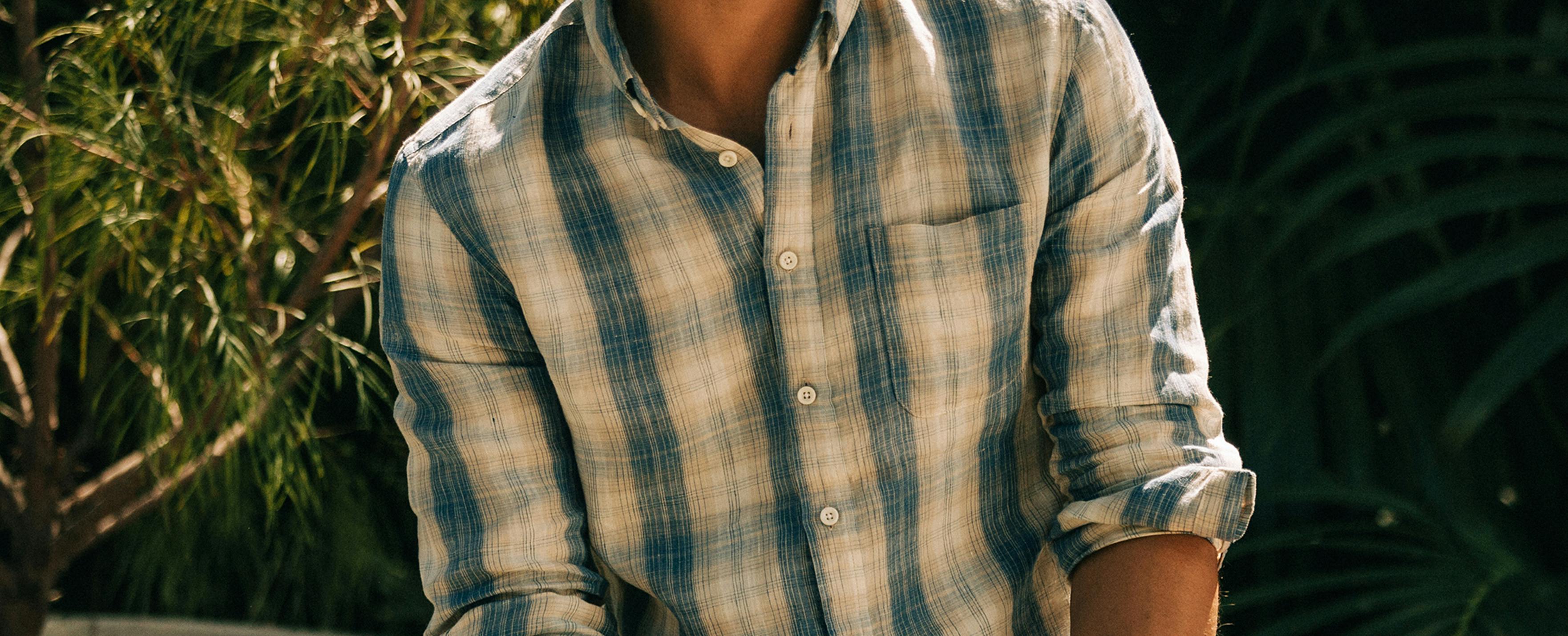 Man wearing plaid button up shirt