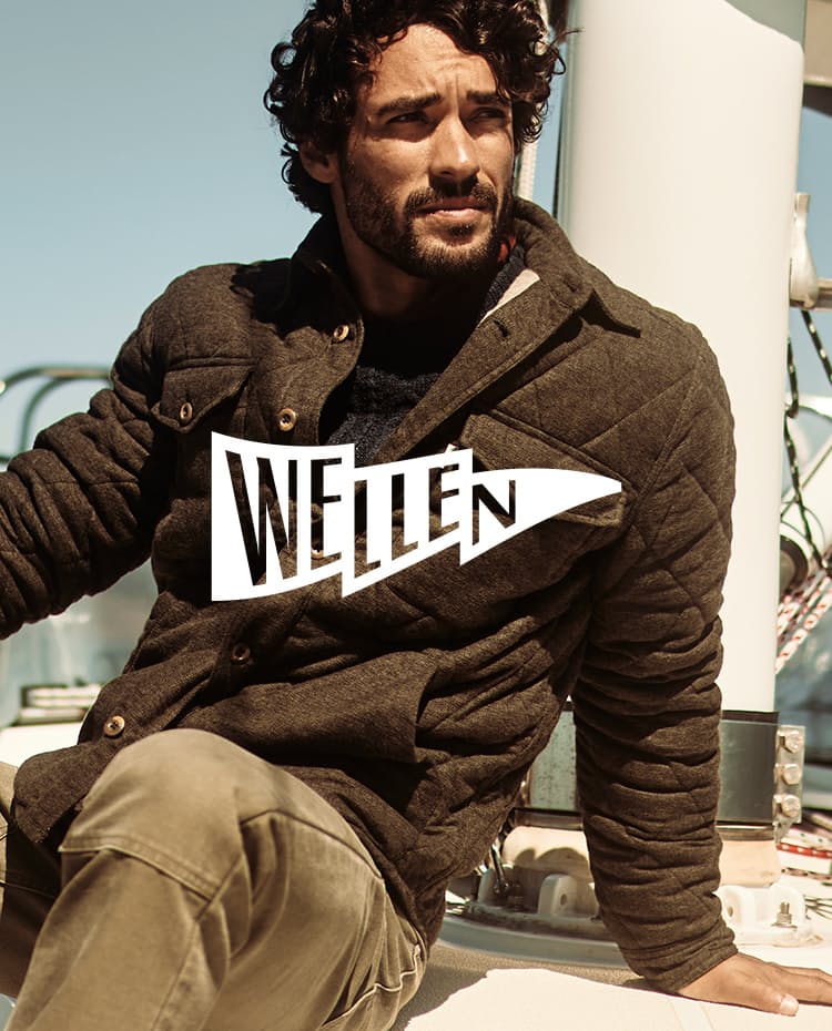 Wellen - Man sitting on boat wearing a jacket