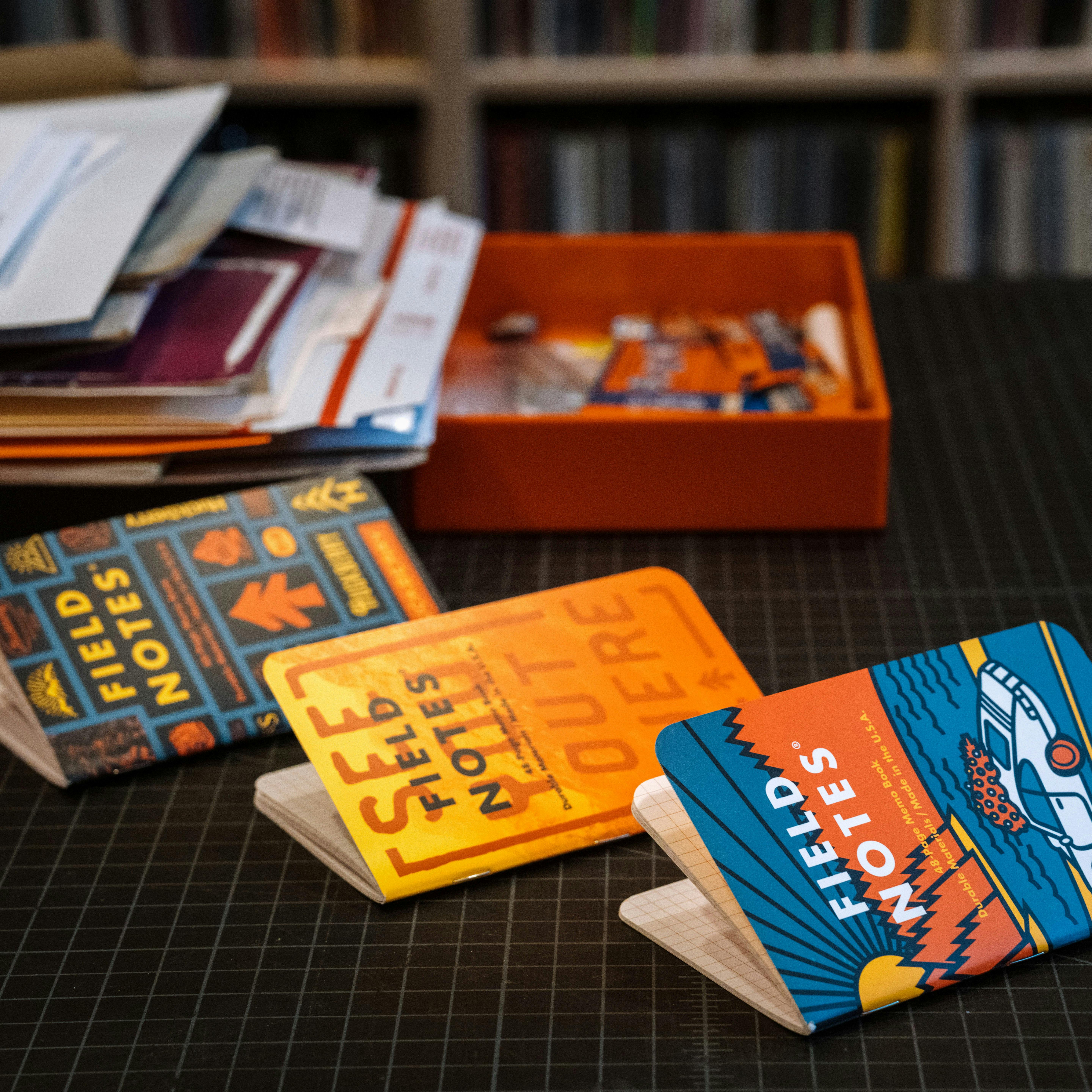https://huckberry.imgix.net/spree/products/692032/original/78648_Field_Notes_Huckberry_x_Draplin_for_Field_Notes_3-Pack_-_Exclusive_3_Pack_Lifestyle_26_PDP_WEB.jpg?auto=format%2C%20compress&crop=top&fit=clip&cs=tinysrgb&ixlib=react-9.5.2